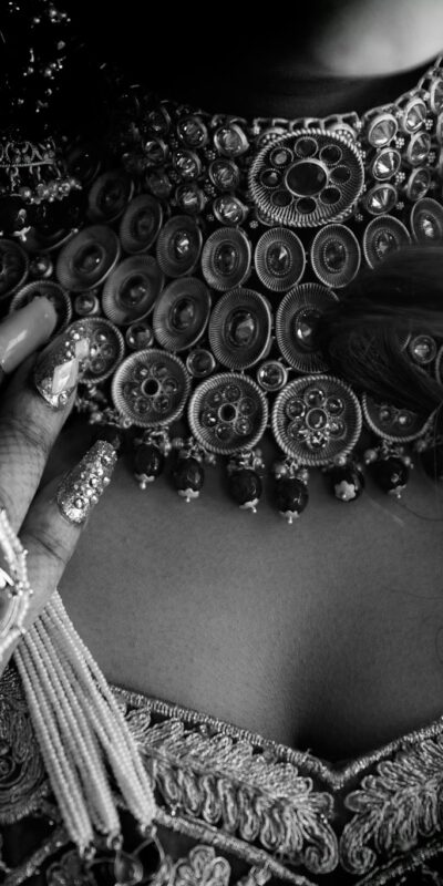 Grayscale Photo of a Person Wearing a Choker Necklace