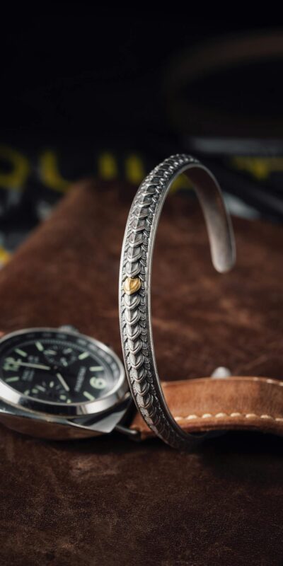 Photo by COPPERTIST WU Silver Bracelet and Watch on a Wallet